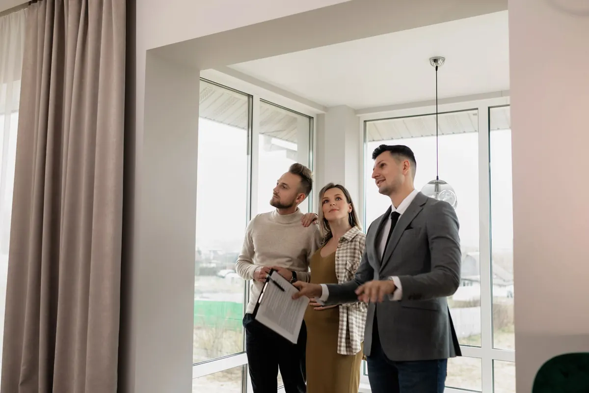 Real estate agent showing a home to a couple