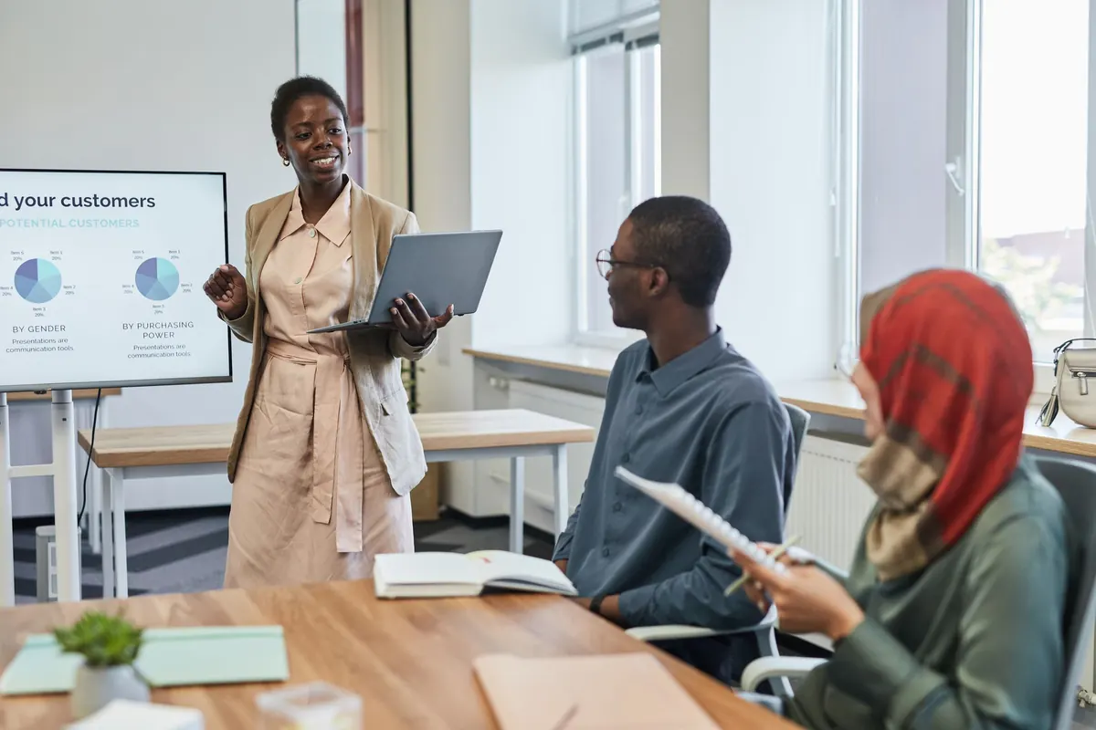 Professionals reviewing charts during a business presentation