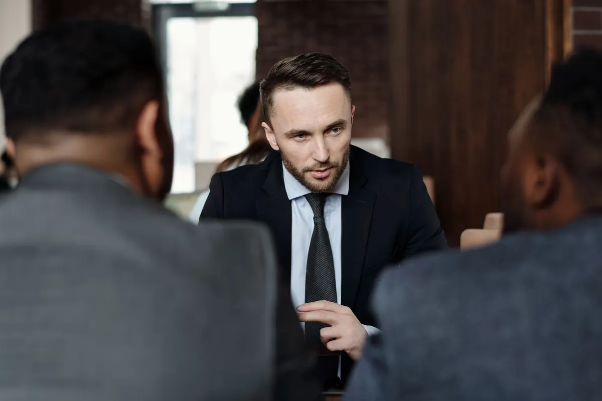 Formal business meeting of professionals in suits