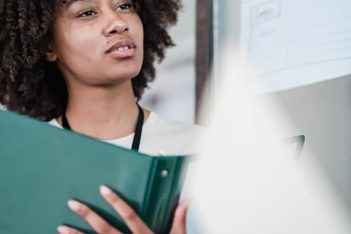 Woman holding files in a business office